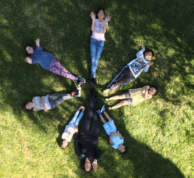 Alma-with-children-on-grass